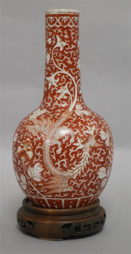 A late/early 19th century Chinese coral red phoenix vase height 29cm incl. carved stand
